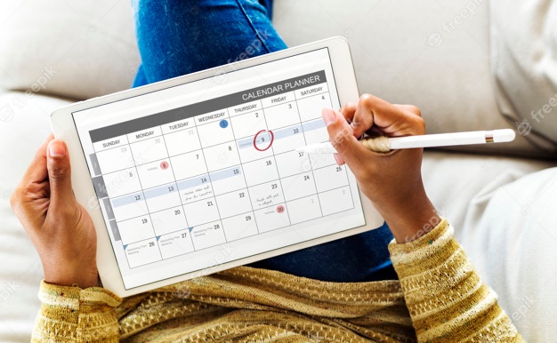 woman-checking-calendar-digital-tablet_53876-28291