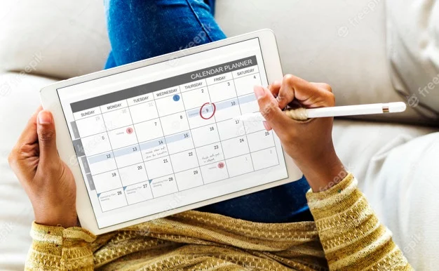 woman-checking-calendar-digital-tablet_53876-28291